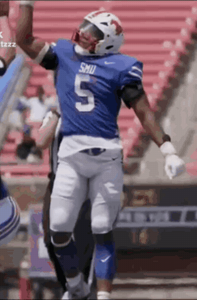 A Football Player Wearing A Blue Jersey With The Number 5 On It GIF