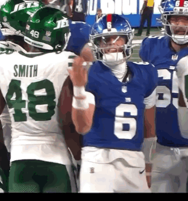 A Football Player Wearing A Blue Jersey With The Number 6 GIF