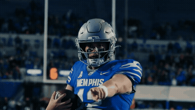A Football Player Wearing A Blue Memphis Jersey GIF