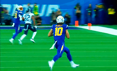 A Football Player Wearing A Blue Uniform With The Number 10 On It GIF