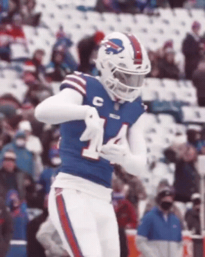 A Football Player Wearing A Buffalo Bills Uniform Is Running On A Field . GIF