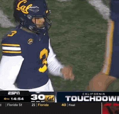 A Football Player Wearing A California Jersey Talks To Another Player GIF