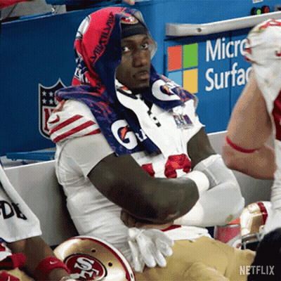 A Football Player Wearing A Gatorade Towel Around His Neck GIF