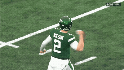A Football Player Wearing A Green Jersey With The Number 2 On It GIF