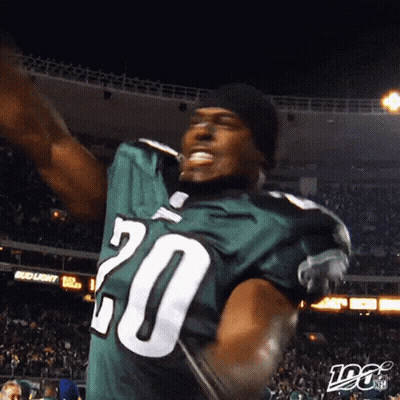 A Football Player Wearing A Green Jersey With The Number 20 GIF