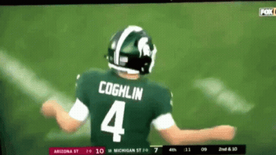 A Football Player Wearing A Green Jersey With The Number 4 On It GIF