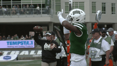 A Football Player Wearing A Green Jersey With The Word Ohio On It GIF