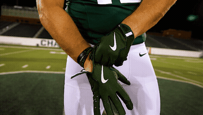 A Football Player Wearing A Green Nike Glove GIF