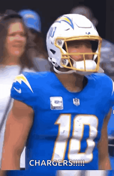 A Football Player Wearing A Helmet And A Blue Jersey With The Number 10 On It . GIF