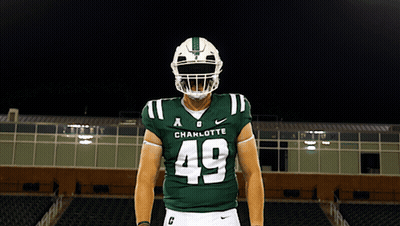 A Football Player Wearing A Helmet And A Jersey That Says Charlotte On It GIF