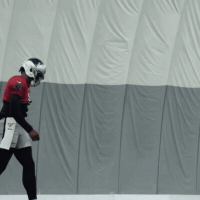 A Football Player Wearing A Helmet And A Jersey That Says Patriots On It GIF