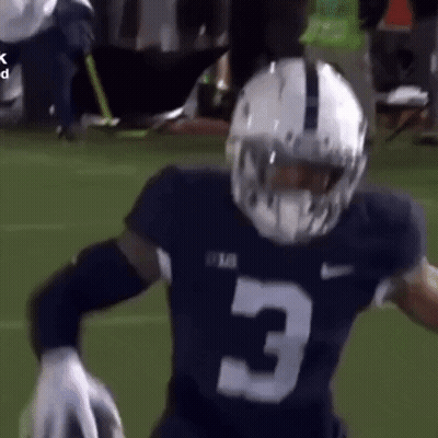 A Football Player Wearing A Helmet And A Jersey With The Number 3 On It Is Running On The Field . GIF