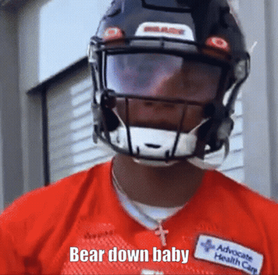 A Football Player Wearing A Helmet And A Red Shirt Says Bear Down Baby . GIF