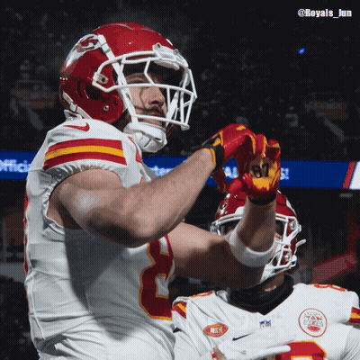 A Football Player Wearing A Helmet And Gloves With The Number 87 On Them GIF