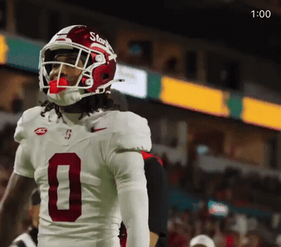 A Football Player Wearing A Helmet And Jersey With The Number 0 On It GIF