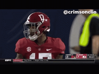 A Football Player Wearing A Helmet And Number 14 Jersey GIF