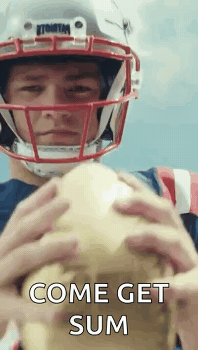 A Football Player Wearing A Helmet Is Holding A Football And Says Come Get Sum . GIF
