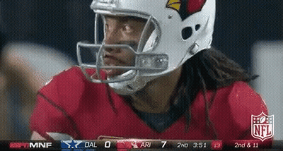 A Football Player Wearing A Helmet Looks At The Scoreboard GIF