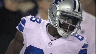 A Football Player Wearing A Helmet That Has A Star On It GIF