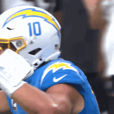 A Football Player Wearing A Helmet That Says 10 GIF