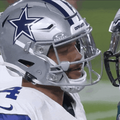 A Football Player Wearing A Helmet That Says Cowboys On The Front GIF