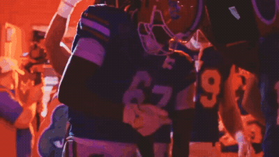 A Football Player Wearing A Helmet That Says Gators On It GIF
