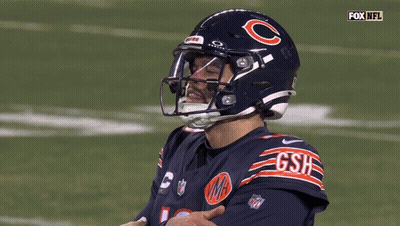 A Football Player Wearing A Helmet That Says Gsh GIF