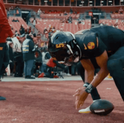 A Football Player Wearing A Helmet That Says Lp On It GIF