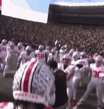 A Football Player Wearing A Helmet That Says Ohio State On It GIF