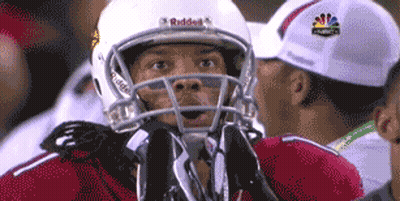 A Football Player Wearing A Helmet That Says Riddell GIF