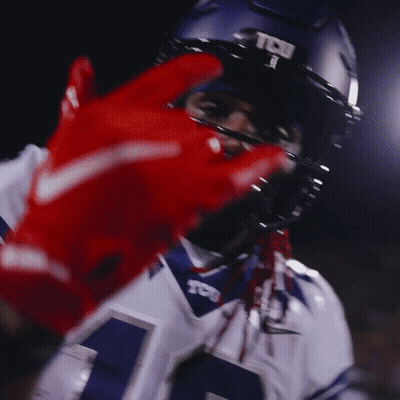 A Football Player Wearing A Helmet That Says Tcj On It GIF