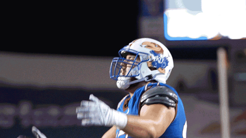 A Football Player Wearing A Helmet That Says Ucsd GIF