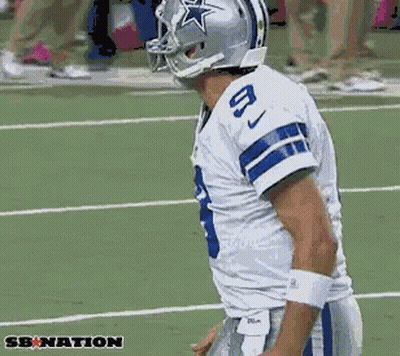 A Football Player Wearing A Helmet With A Star On It And The Number 8 On His Jersey GIF