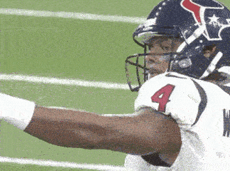 A Football Player Wearing A Helmet With A Texas Flag On It GIF