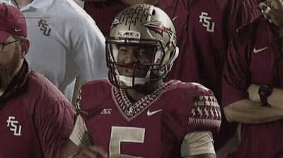 A Football Player Wearing A Helmet With The Letter F On It GIF