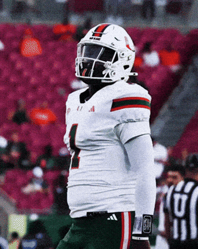 A Football Player Wearing A Helmet With The Number 1 On It GIF
