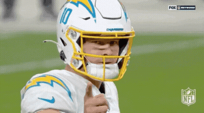 A Football Player Wearing A Helmet With The Number 10 On It GIF