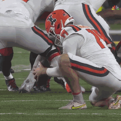 A Football Player Wearing A Helmet With The Number 11 On It GIF