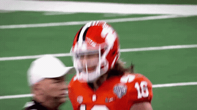 A Football Player Wearing A Helmet With The Number 16 On The Front GIF
