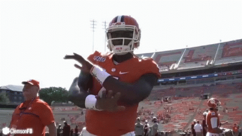 A Football Player Wearing A Jersey That Says Clemson Is Dancing GIF