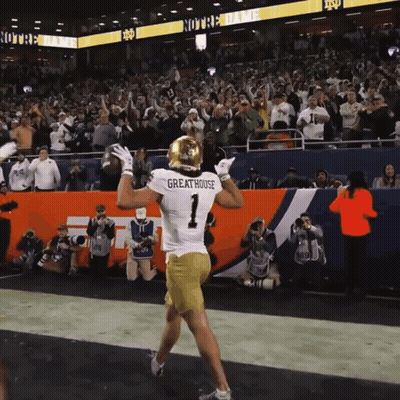 A Football Player Wearing A Jersey That Says Greathouse GIF