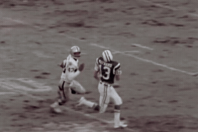 A Football Player Wearing A Jersey With The Number 12 On It GIF