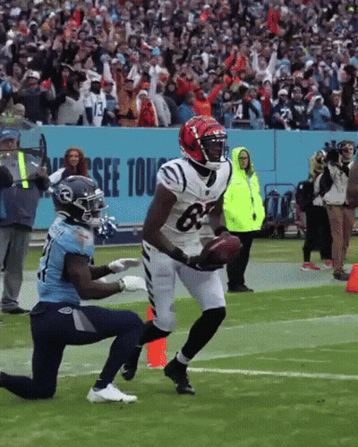 A Football Player Wearing A Jersey With The Number 63 On It GIF