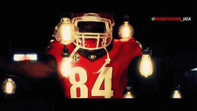 A Football Player Wearing A Jersey With The Number 84 On It GIF