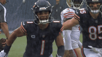 A Football Player Wearing A Jersey With The Number 85 On It GIF