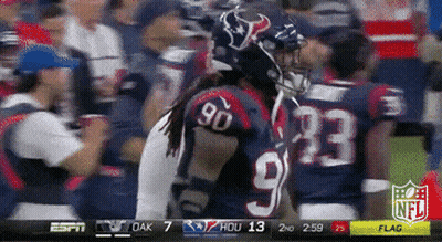 A Football Player Wearing A Jersey With The Number 90 On It GIF