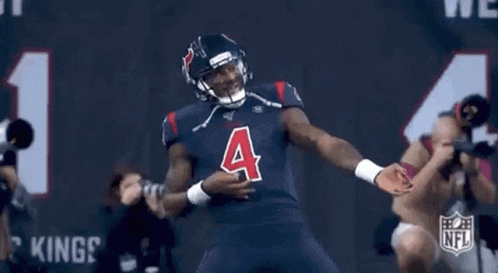A Football Player Wearing A Jersey With The Number Four On It GIF
