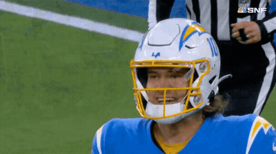 A Football Player Wearing A La Helmet Stands On The Field GIF