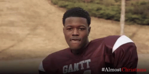 A Football Player Wearing A Maroon And White Jersey With The Word Gantt On It . GIF