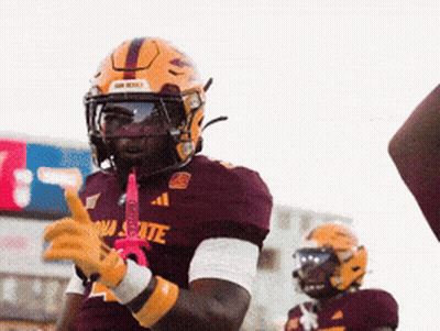 A Football Player Wearing A Maroon Jersey That Says Arizona State On It GIF